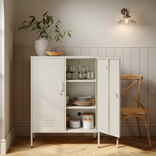 The Fulham metal storage locker in vanilla with 2 doors, one open showing tableware inside